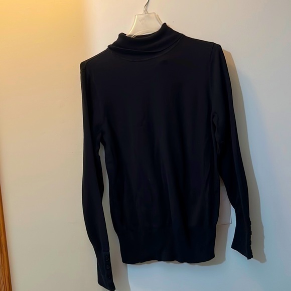 Fashion bug says extra-large sweater with button detail sleeves